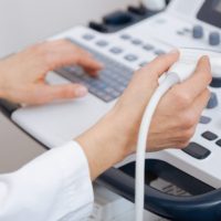 aging-professional-concentrated-sonographer-working-clinic-while-providing-ultrasonic-body-examination-holding-ultrasound-linear-transducer-1536x1024-1-768x512